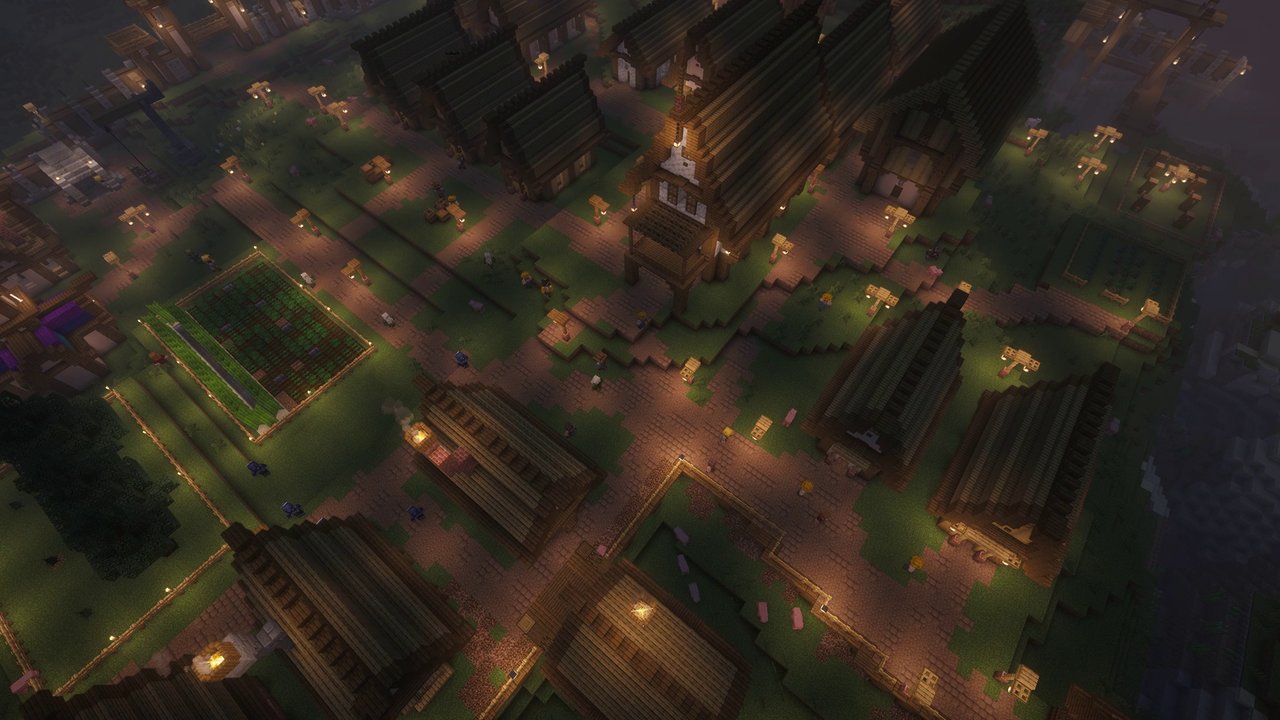 A village in the evening with villagers heading to the tavern and lights on in the houses